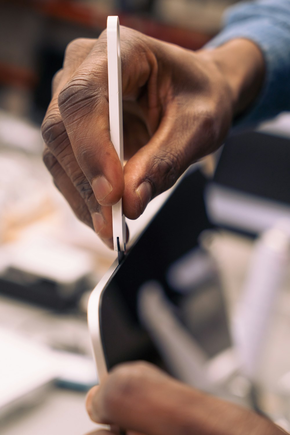 a person holding a piece of paper in their hand