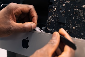 a man working on an apple computer