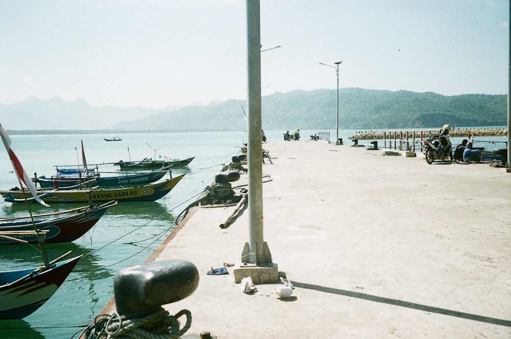 a group of boats that are sitting in the water