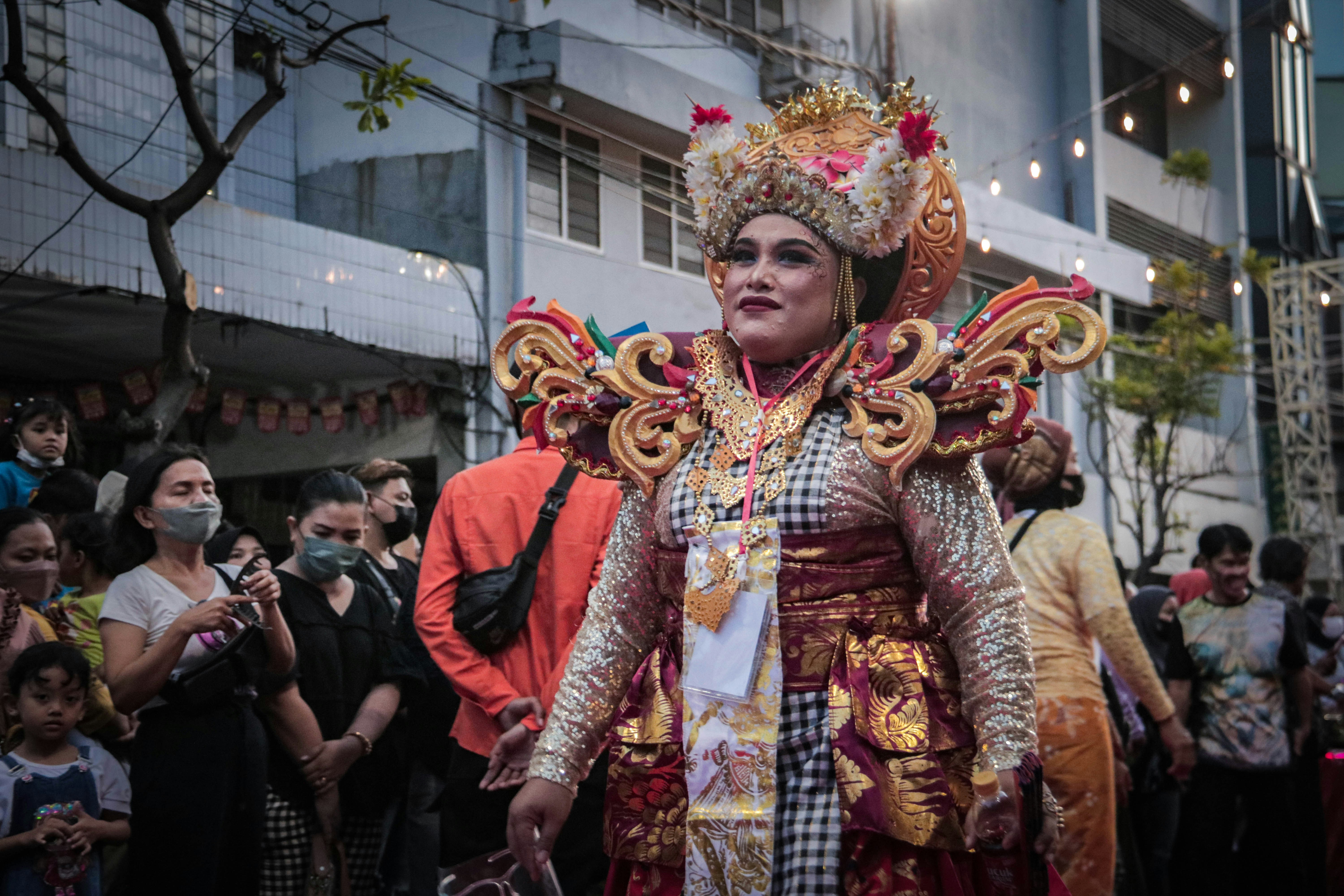 a woman in a costume walking down a street