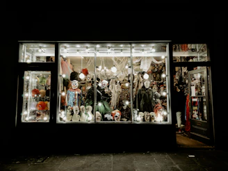 Rows of mascot costumes displayed ready for rent in a bright, welcoming store interior.