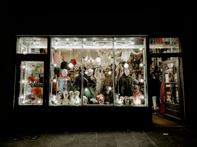Rows of mascot costumes displayed ready for rent in a bright, welcoming store interior.