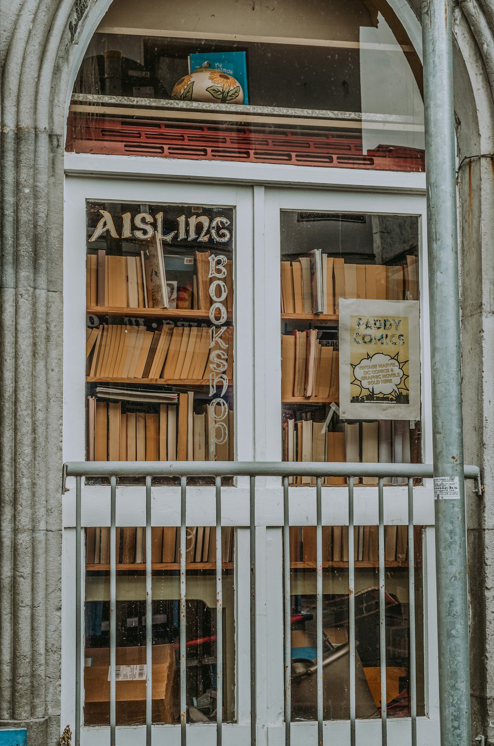 a window that has a bunch of books in it