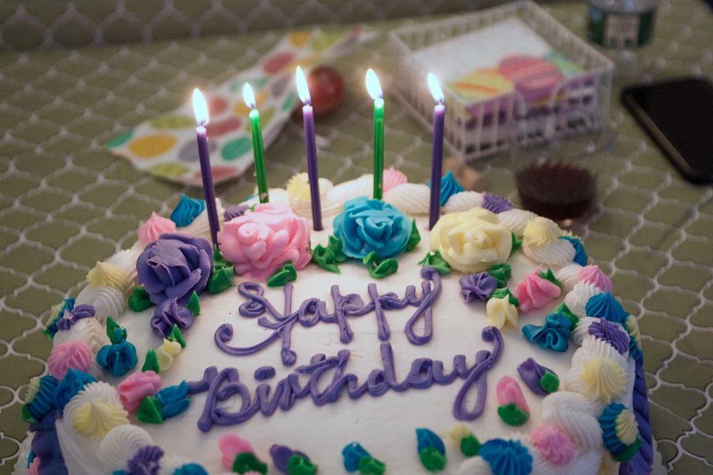 a birthday cake with candles on top of it