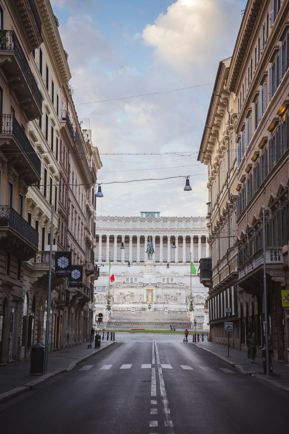 an empty street with a building in the background