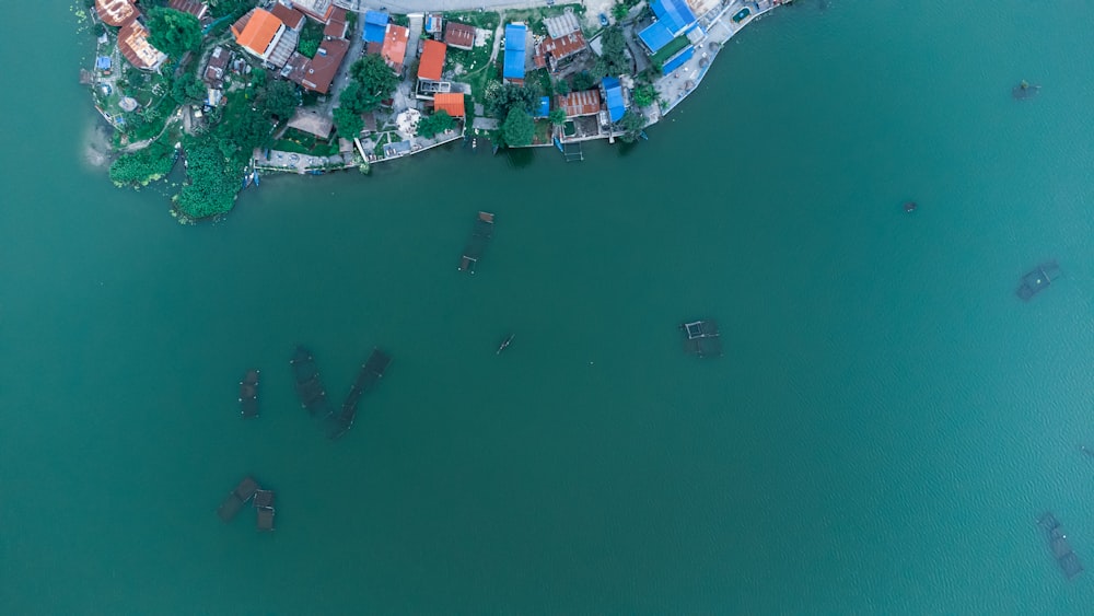a bird's eye view of a small village on the water