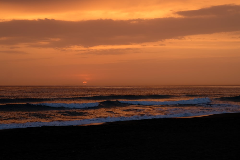 a sunset over a body of water