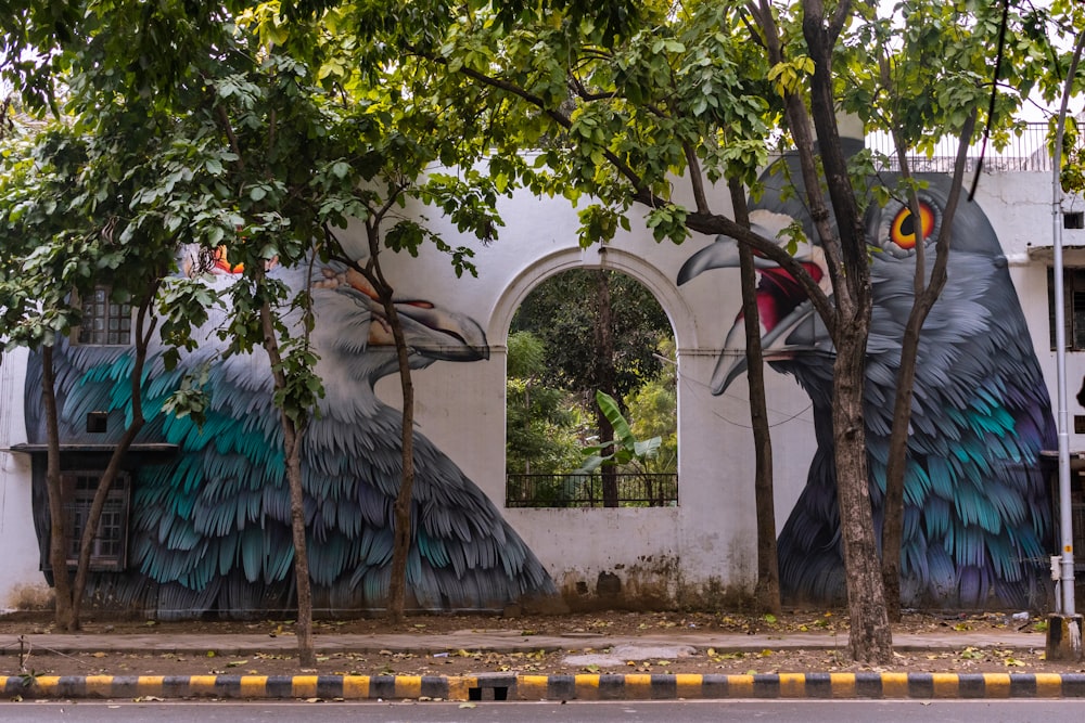 a mural of a bird on the side of a building