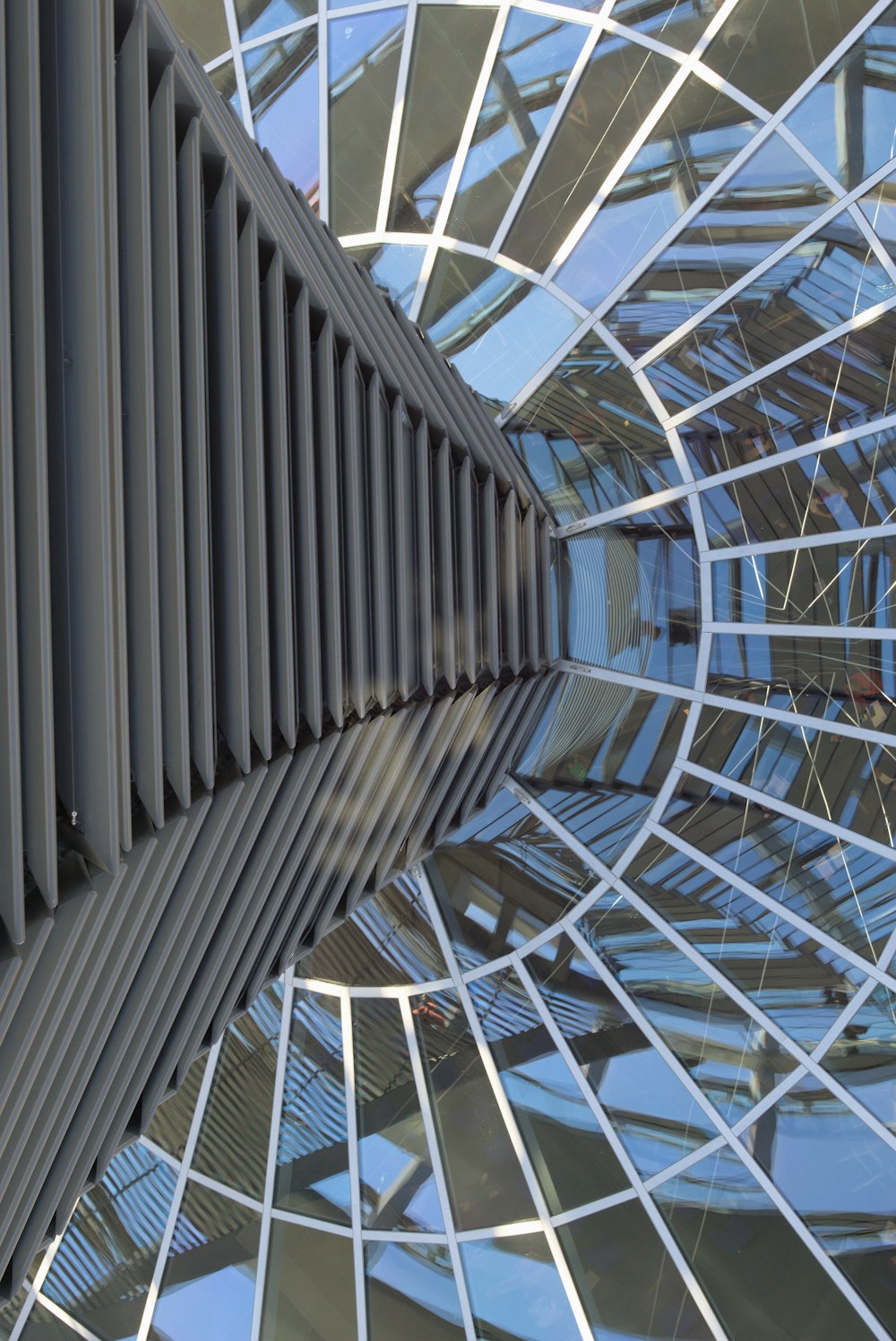 a close up of a metal structure with many windows