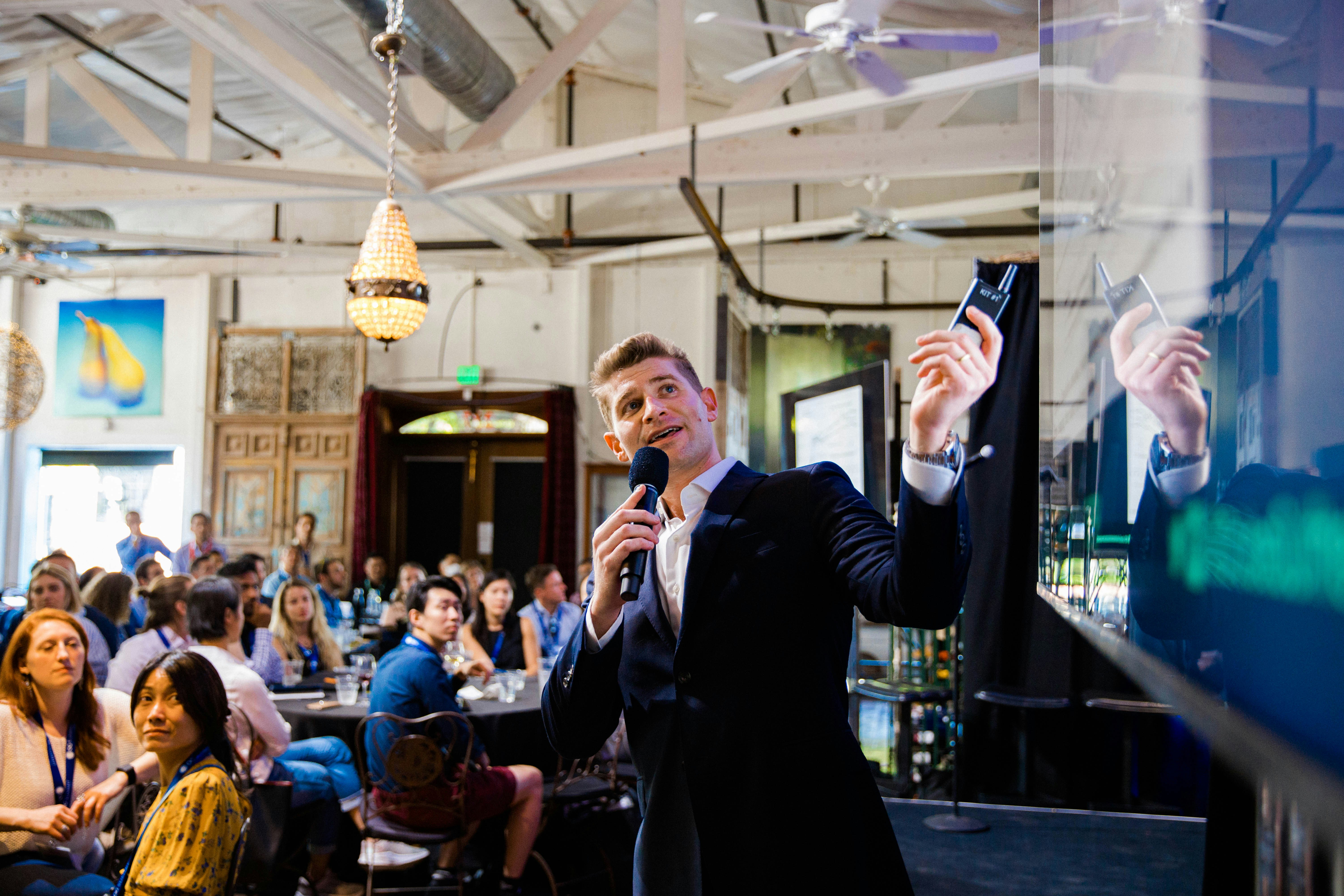 entrepreneur pitching to a crowd - business events near me