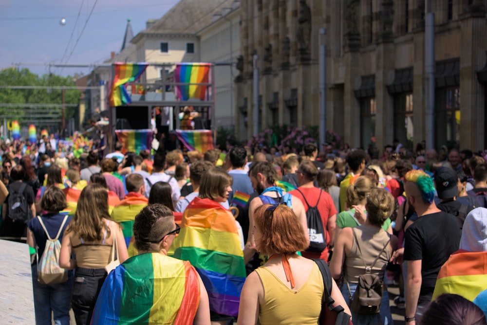 a large group of people walking down a street