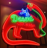 Close-up of a vibrant, freshly painted car wash sign