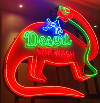 Close-up of a vibrant, freshly painted car wash sign