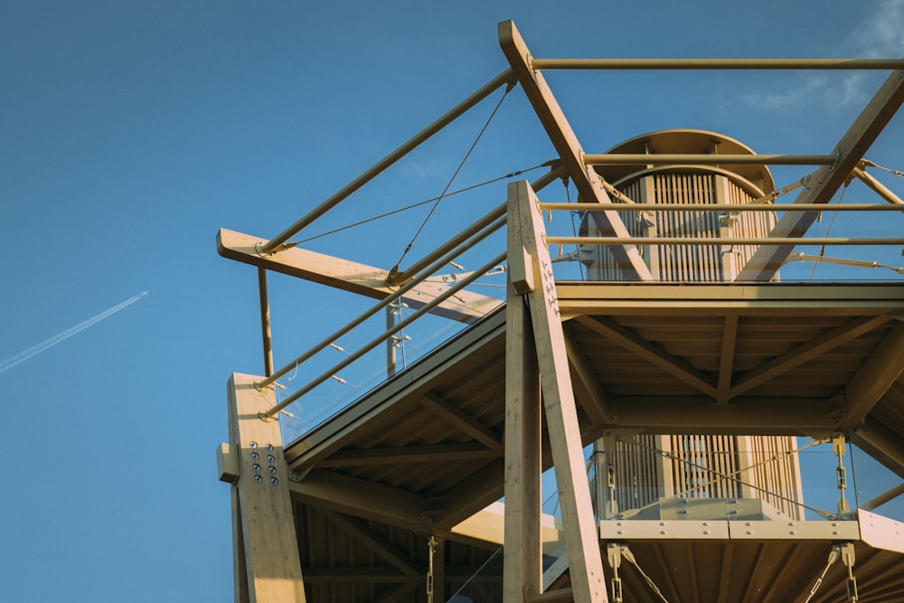 a tall wooden structure with a sky background