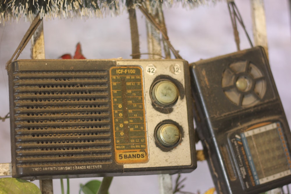 an old fashioned radio hanging from a tree