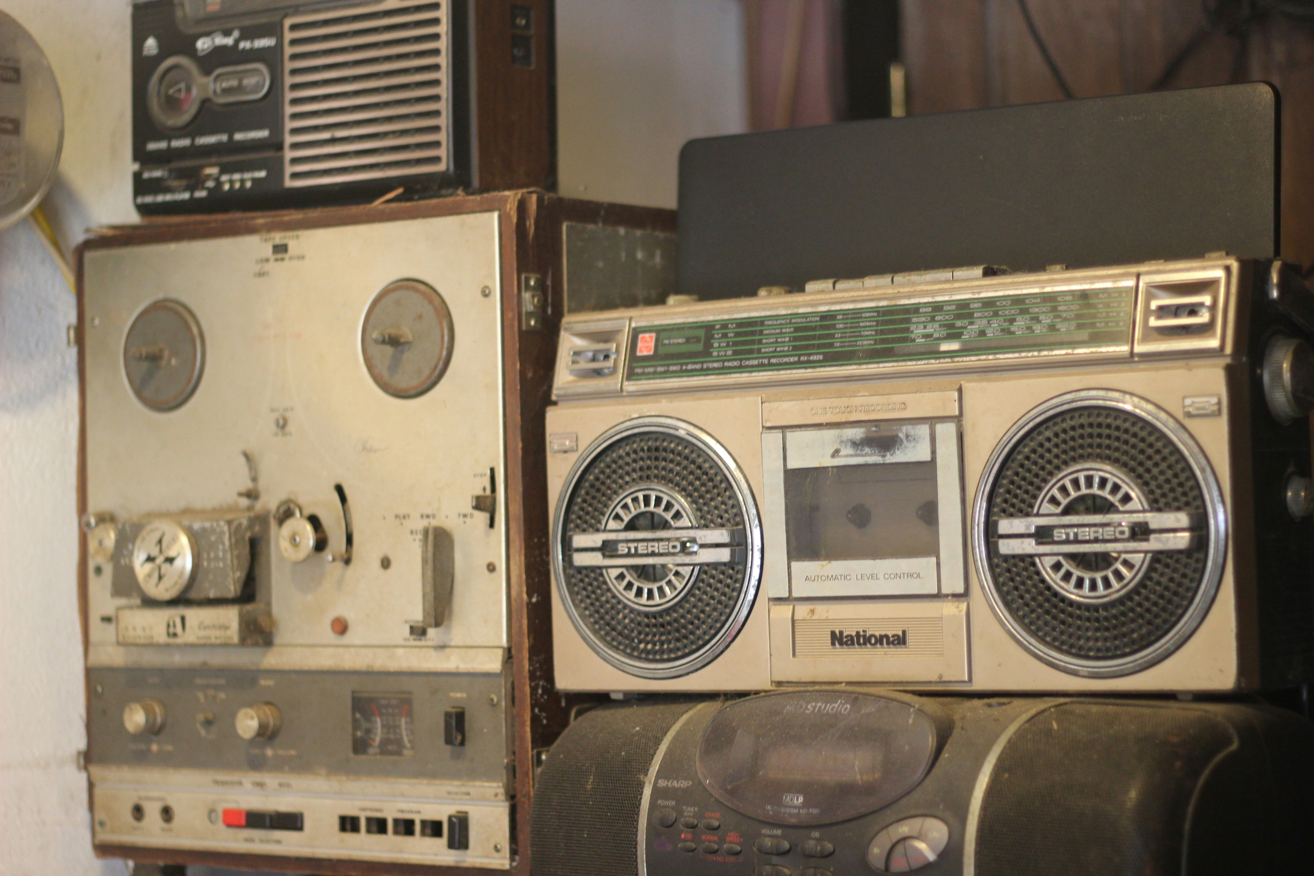 a couple of old radio's sitting next to each other