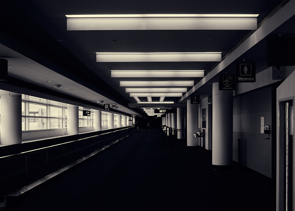 a black and white photo of a train station