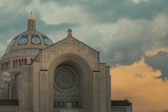 a large cathedral with a clock on the front of it