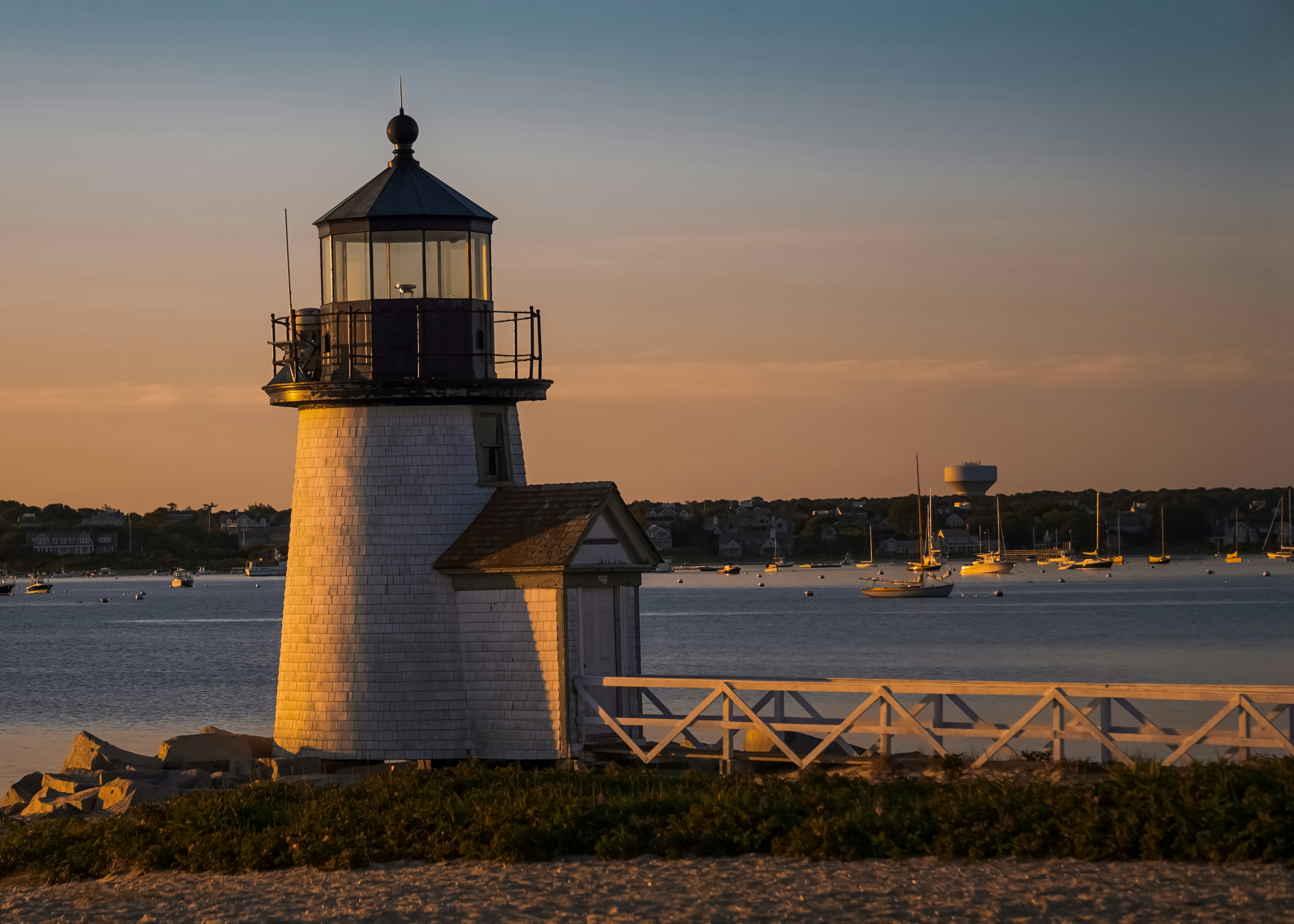 a light house sitting on top of a sandy beach