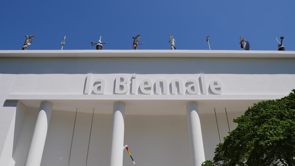 a large white building with statues on top of it