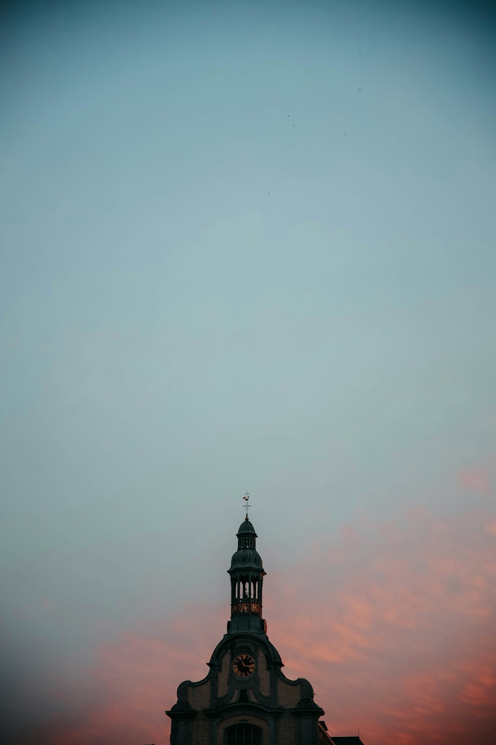 a building with a clock on the top of it