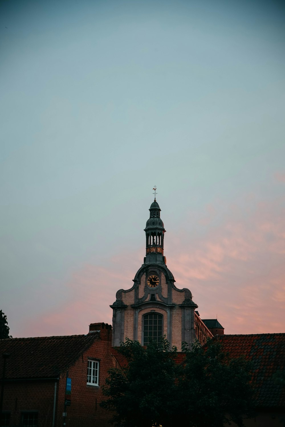 a building with a steeple and a clock on it