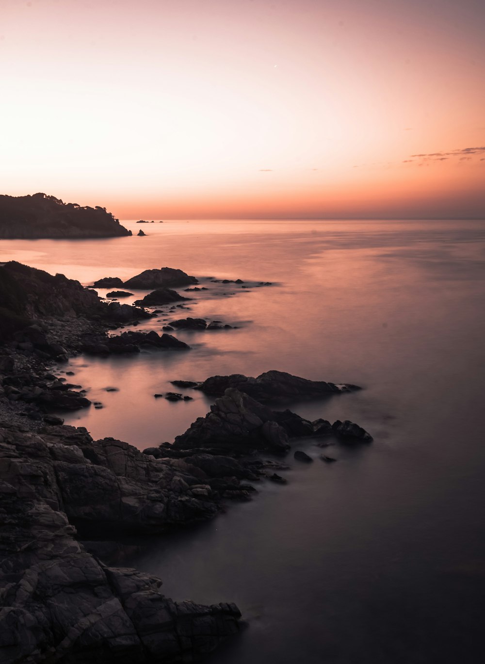 a long exposure of a sunset over the ocean