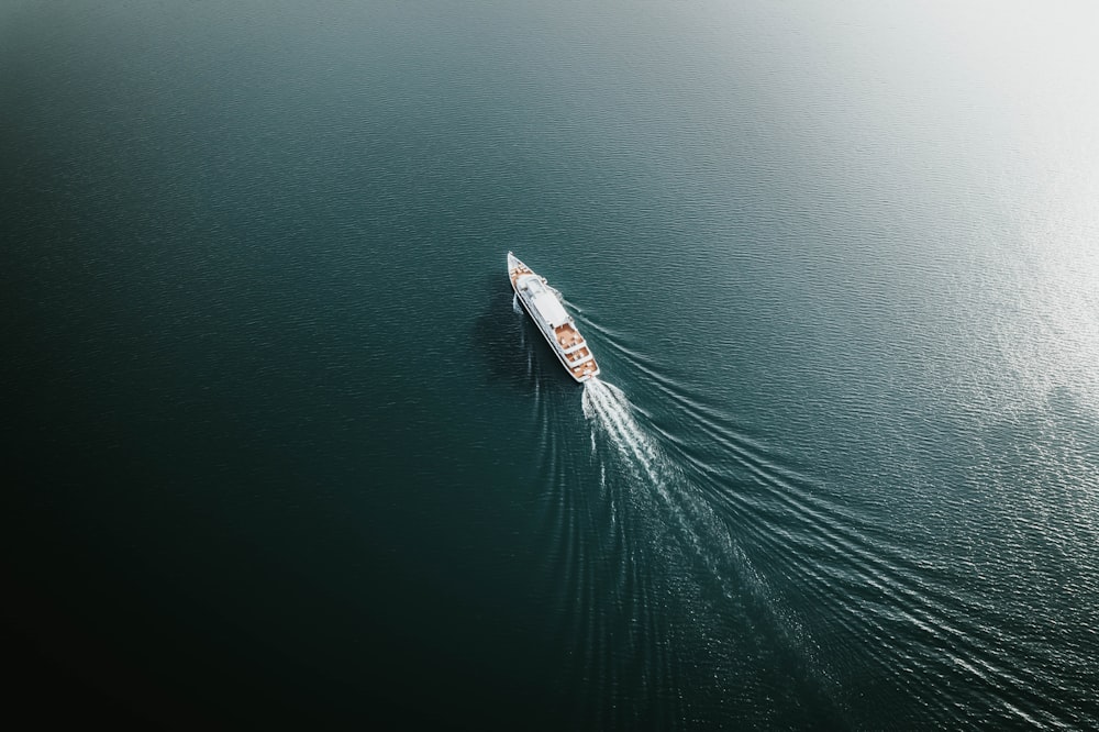 an aerial view of a boat in the water