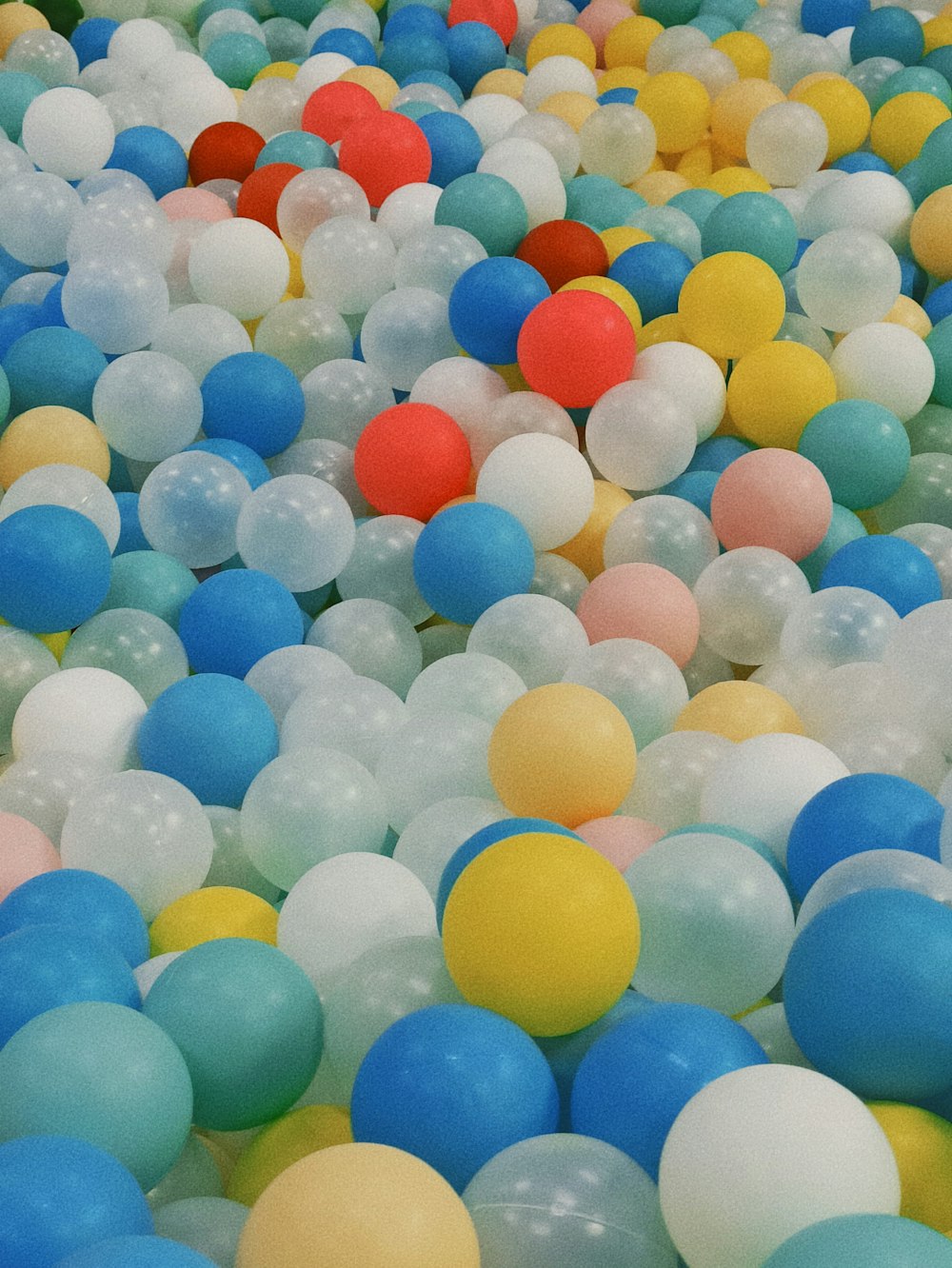 a bunch of balloons that are all different colors