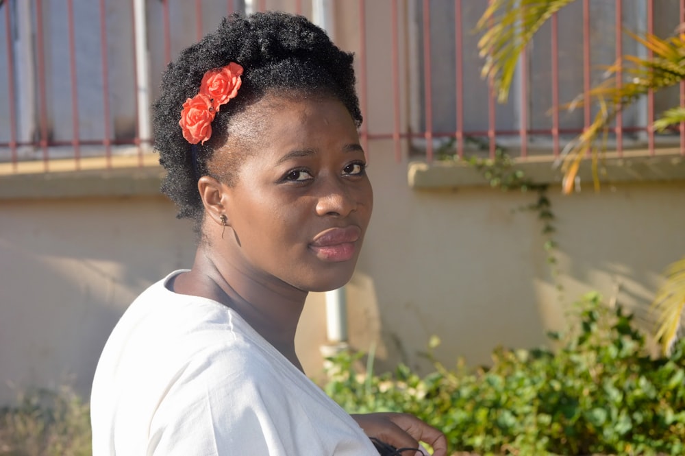 a woman with a flower in her hair