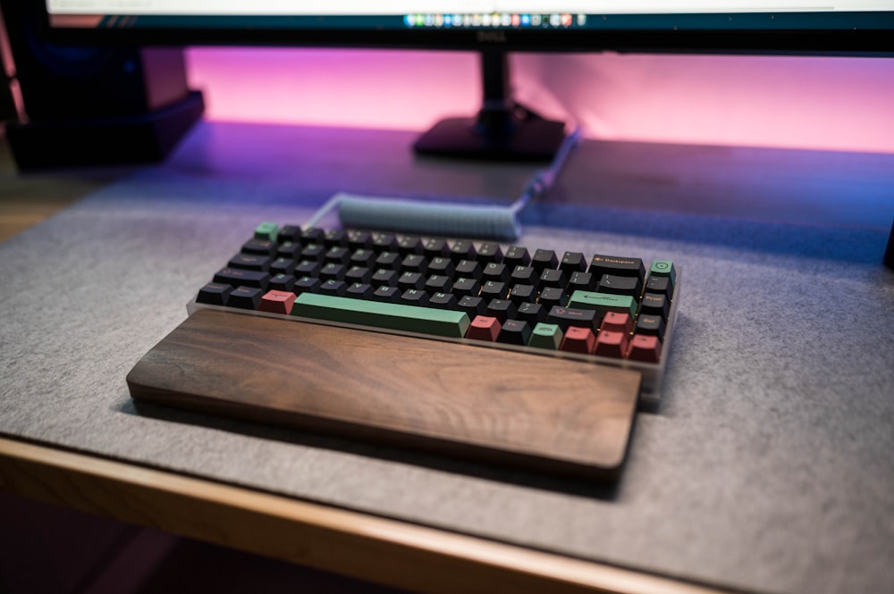 a computer keyboard sitting on top of a desk