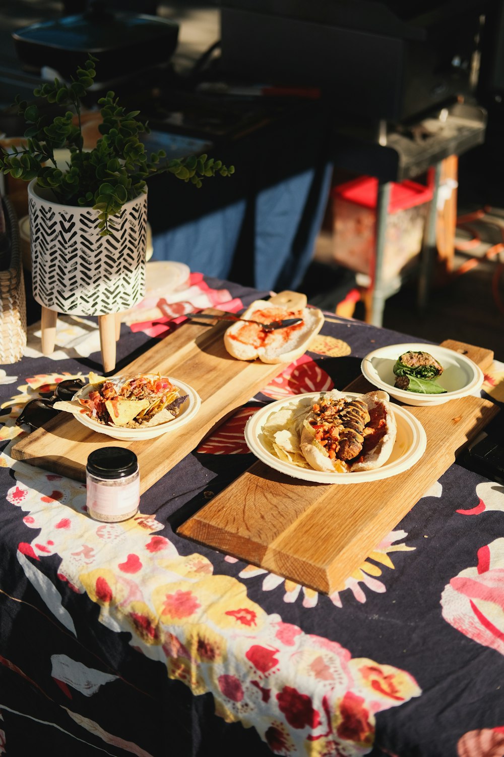 a table topped with plates of food on top of a wooden cutting board