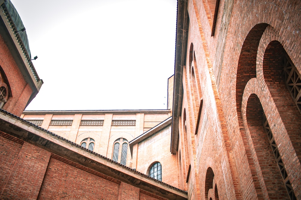 a brick building with a clock on the side of it