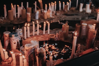 a bunch of candles that are on a table