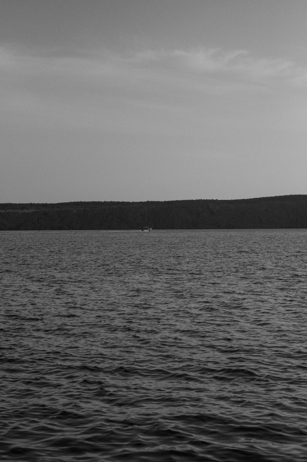 a black and white photo of a body of water