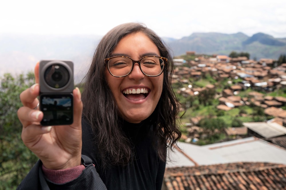 a woman taking a selfie with a camera