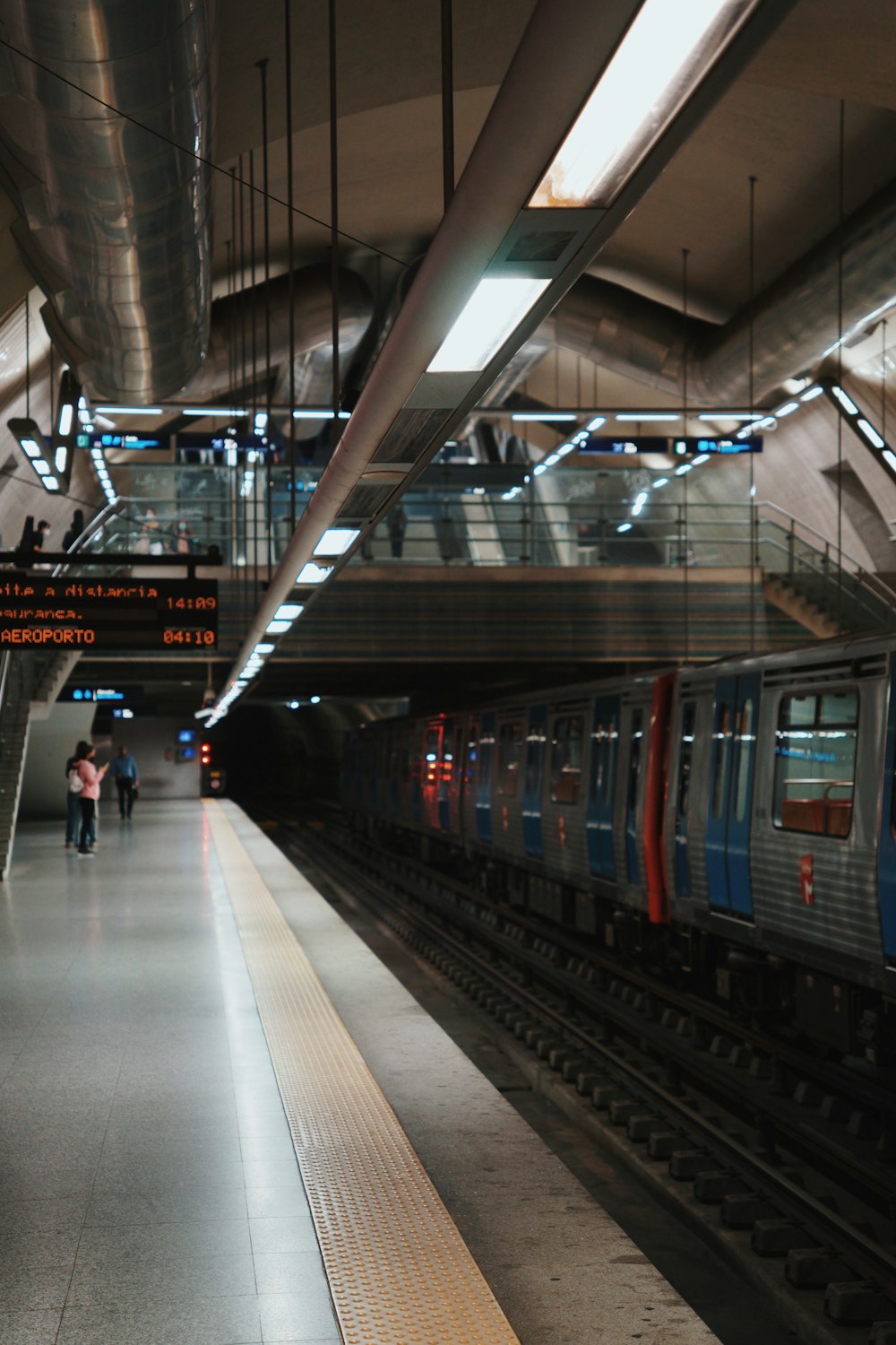 a subway train pulling into a train station