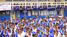 a large group of people in blue and white uniforms