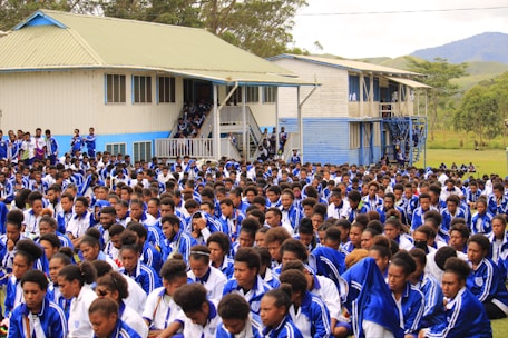 a large group of people standing in front of a building