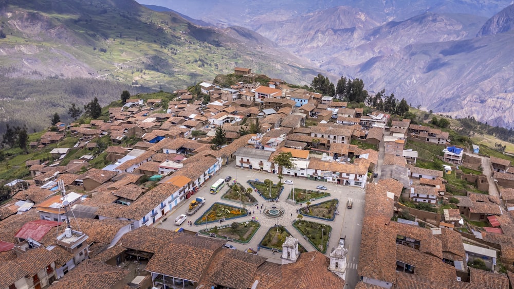 an aerial view of a village in the mountains