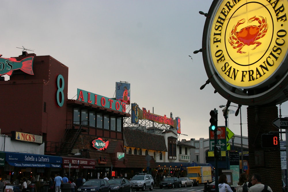 a street scene with focus on a restaurant sign