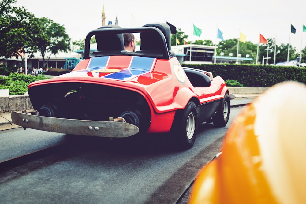 a red car with a british flag painted on it's side