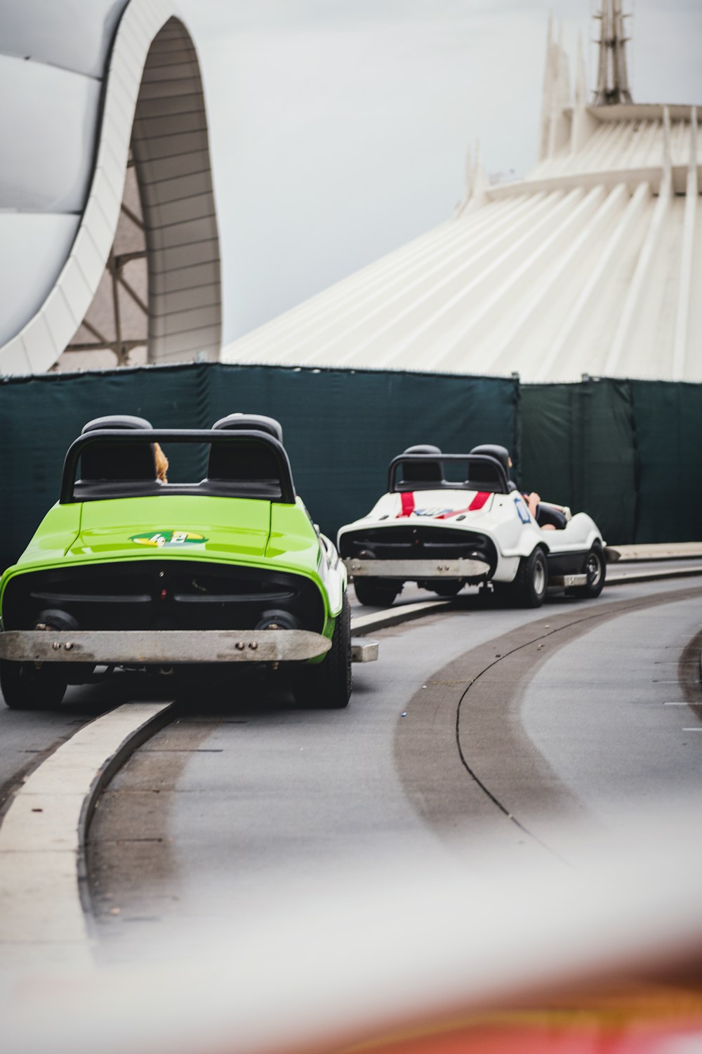 a couple of cars that are sitting in the street