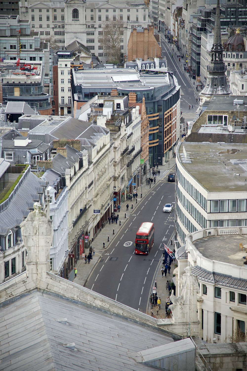 a double decker bus driving down a city street