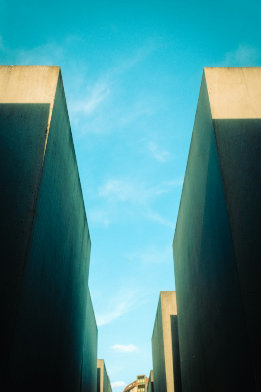 a view of the sky from between two buildings