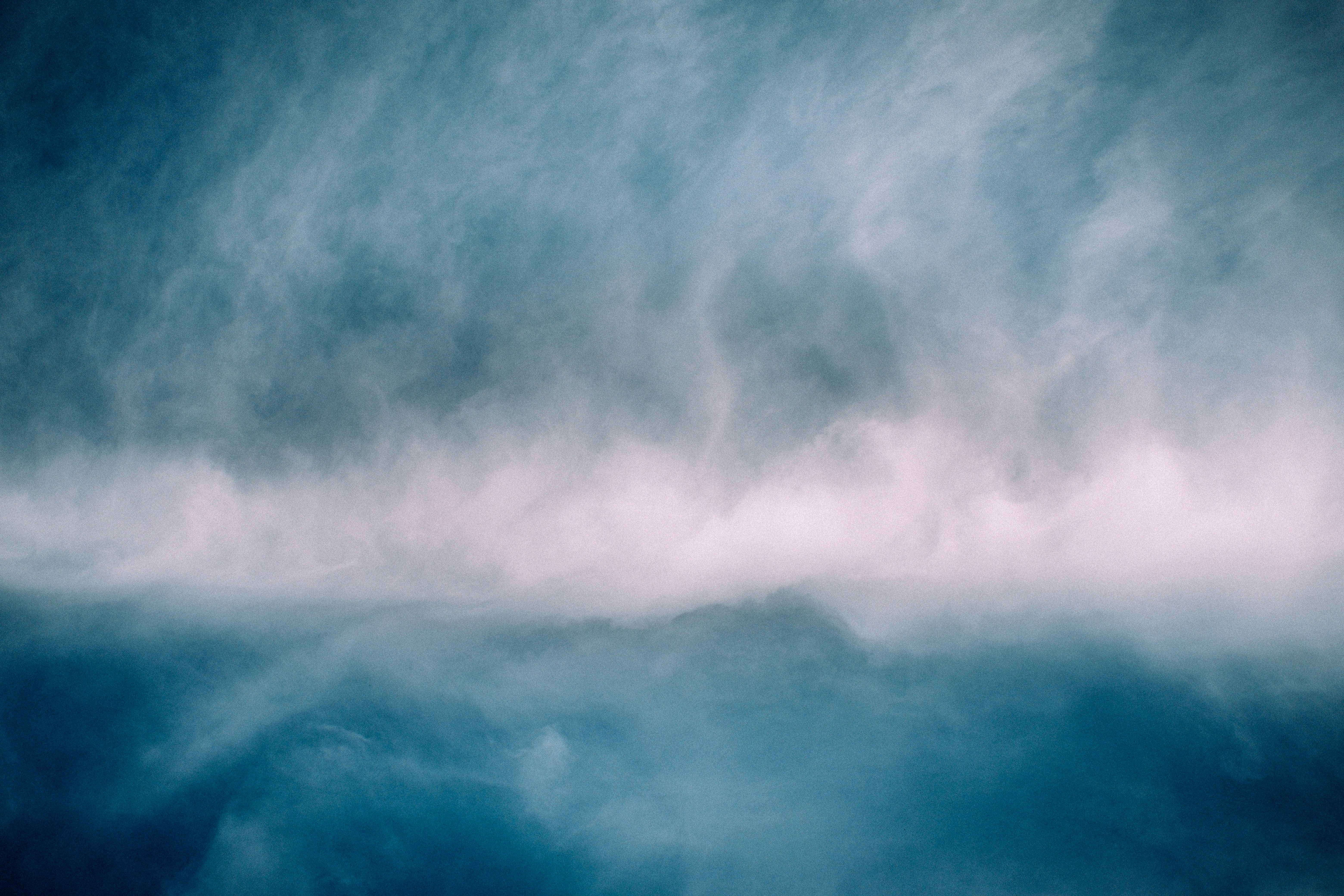 Abstract background with heavenly clouds and light rays.