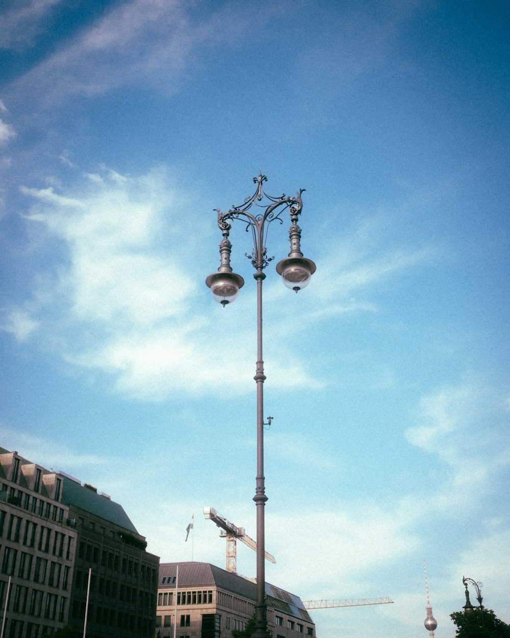 a street light on a pole in front of a building