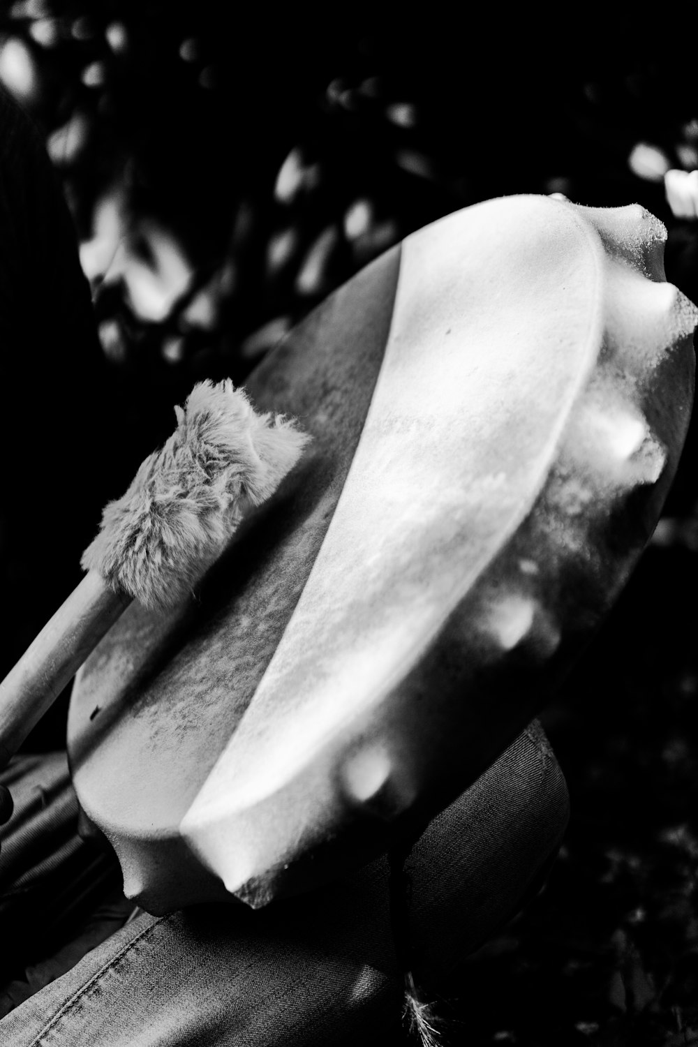 a black and white photo of a hat and a paddle