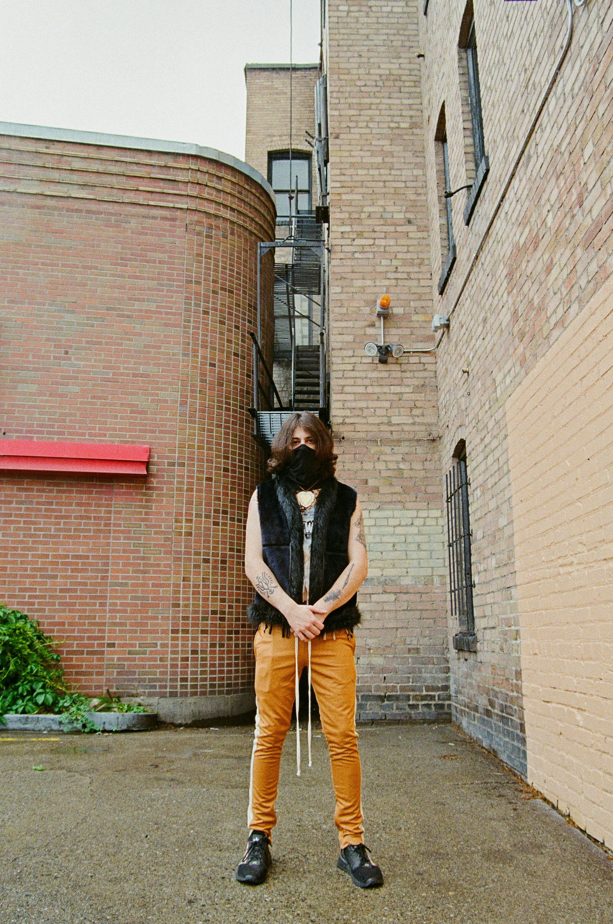 A man standing in front of a brick building photo – Free Spokane Image ...