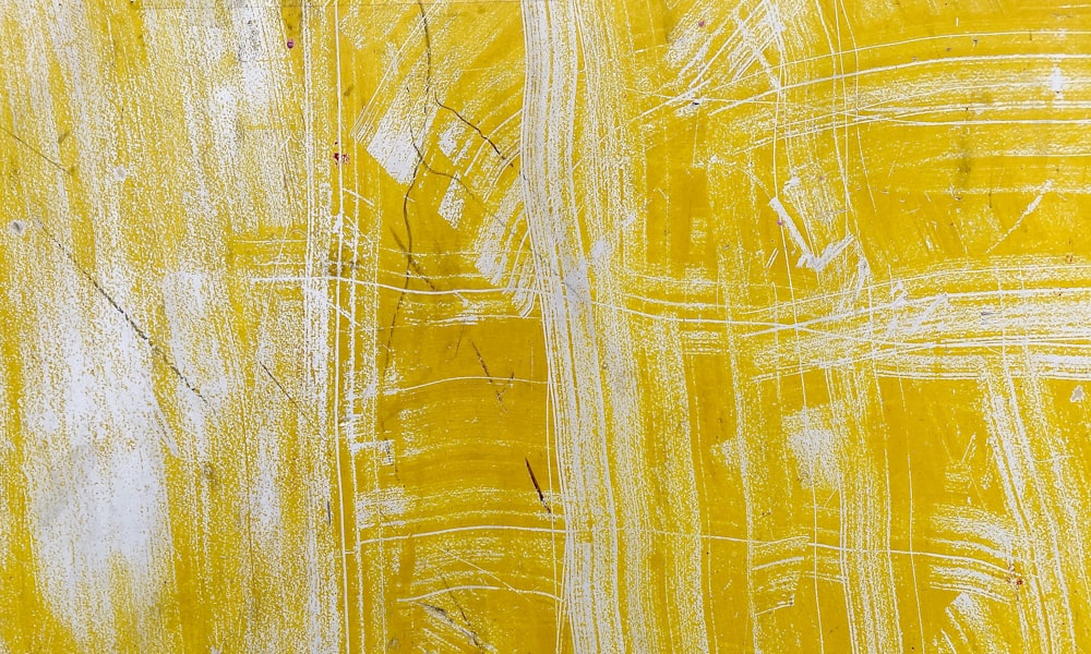 a painting of yellow and white lines on a wall